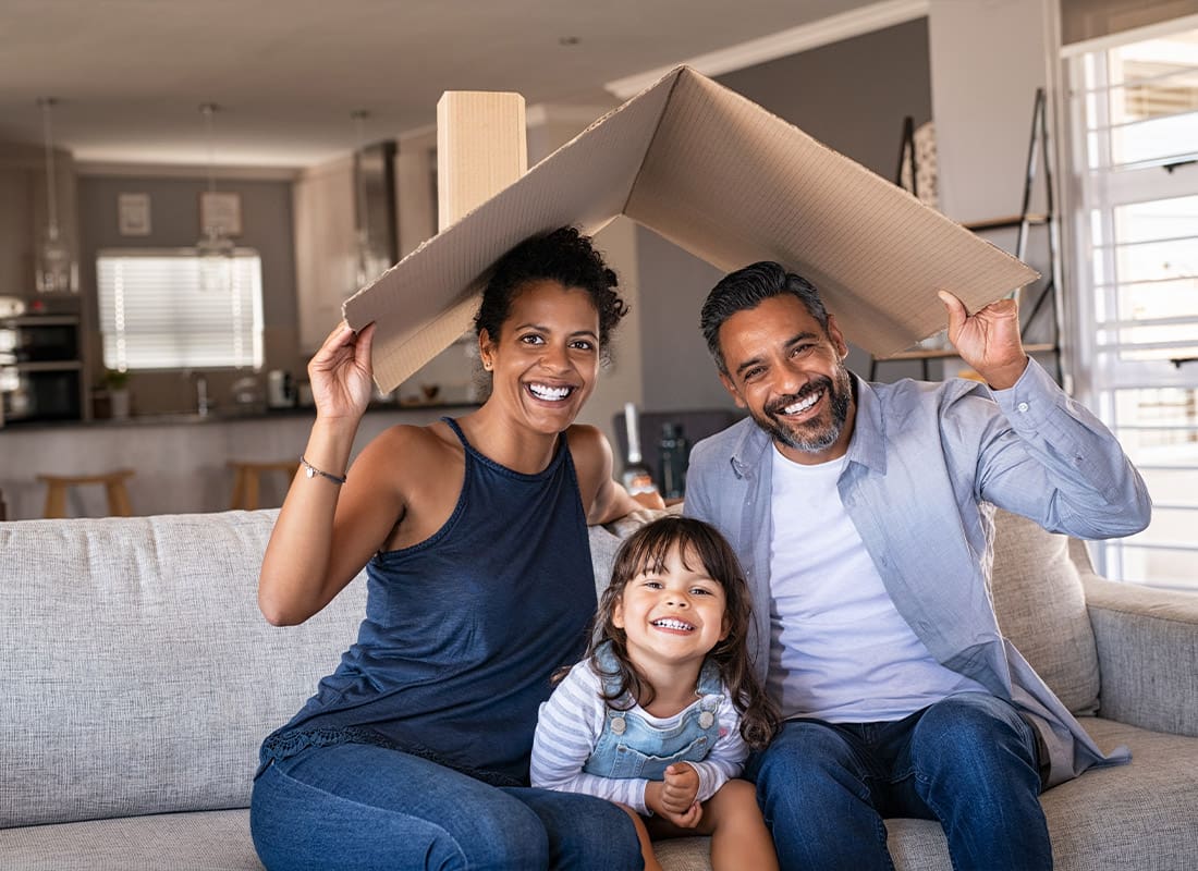 Personal Insurance - Happy Family Taking a Portrait Photo Together at Home in Their Living Room
